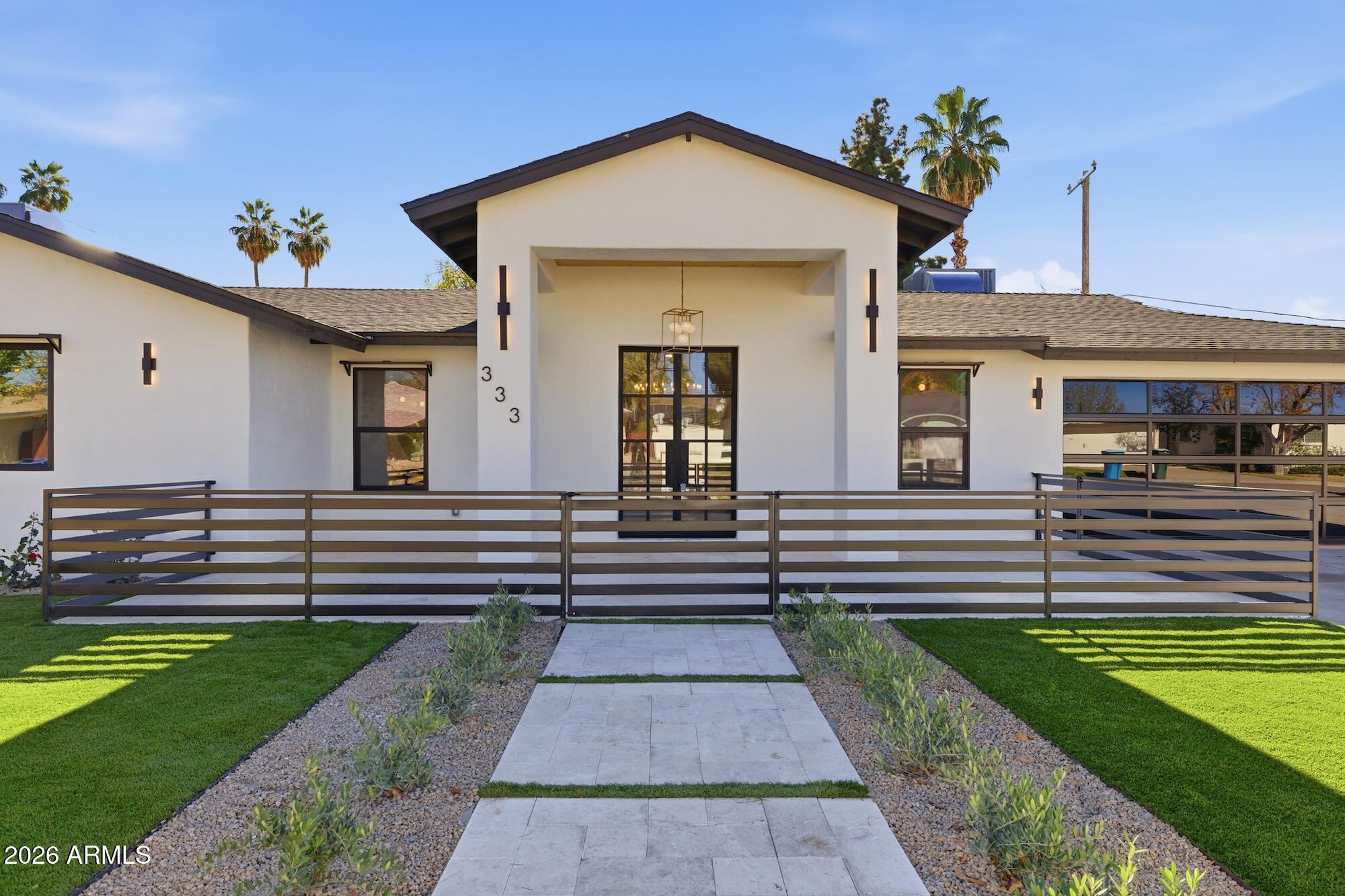 a front view of a house with a yard