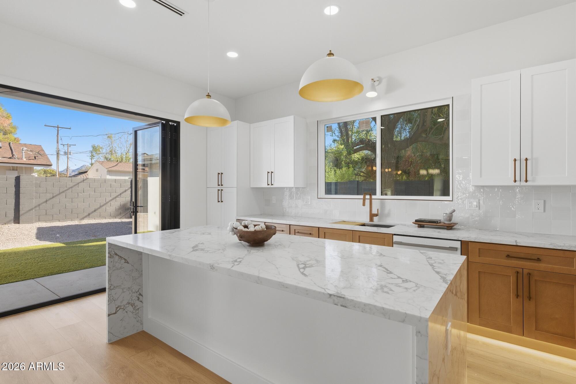 333 West Seldon Lane Phoenix, AZ 85021 - Photo 18 of 73 a kitchen with stainless steel appliances a sink and a large window
