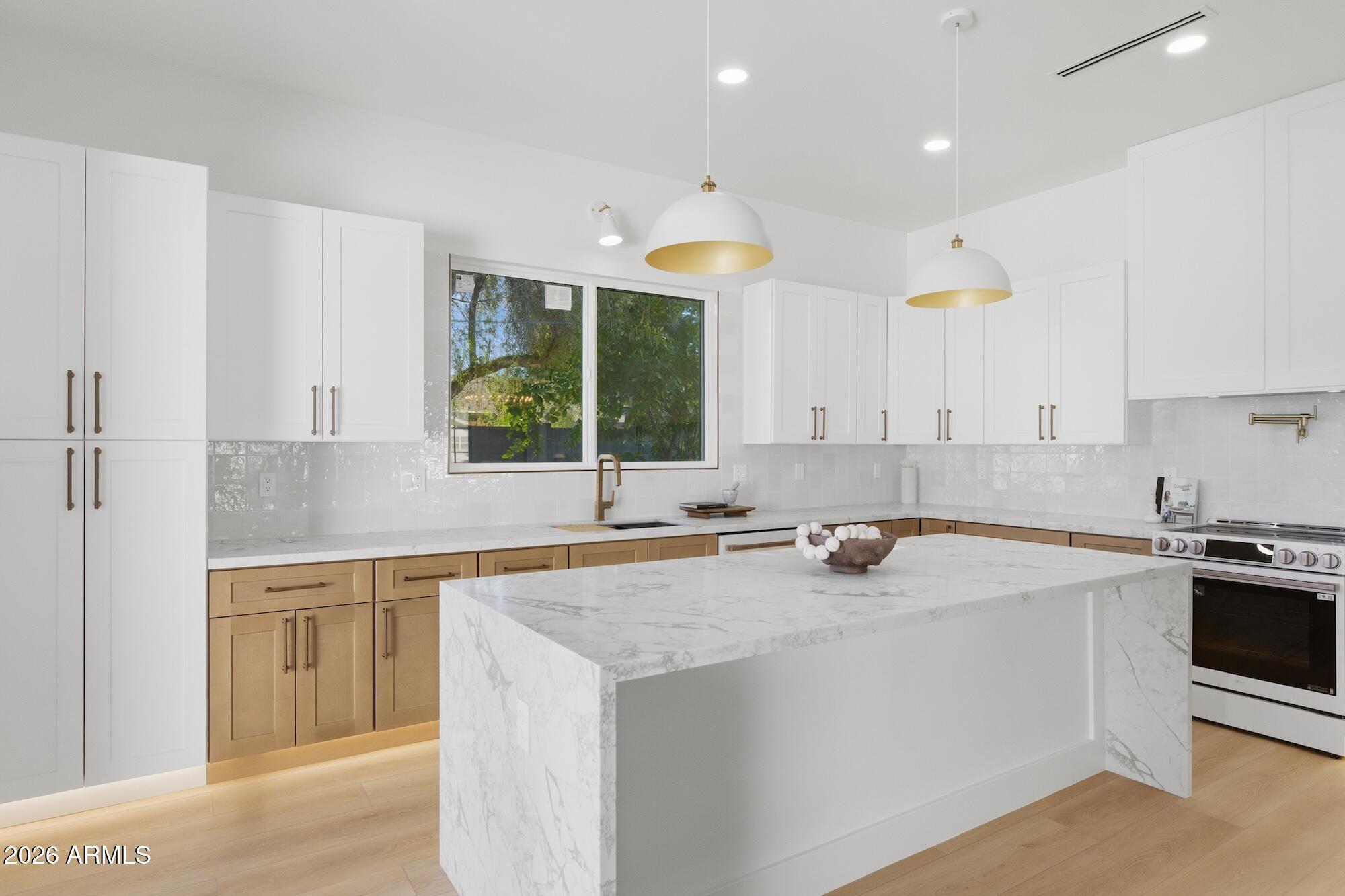 333 West Seldon Lane Phoenix, AZ 85021 - Photo 21 of 73 a kitchen with a sink stove and cabinets