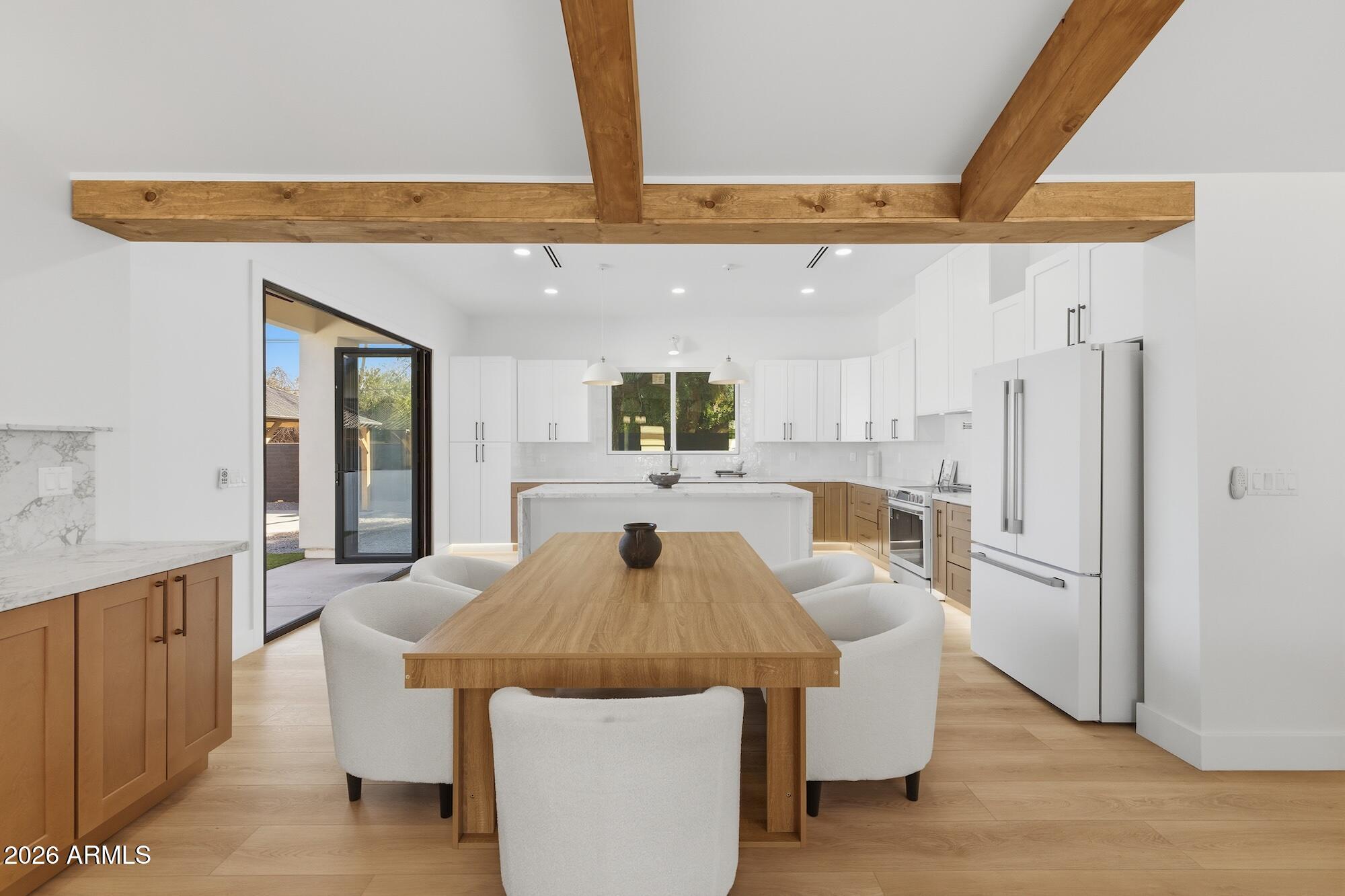 333 West Seldon Lane Phoenix, AZ 85021 - Photo 23 of 73 a kitchen with stainless steel appliances granite countertop a refrigerator a sink a stove and white cabinets with wooden floor