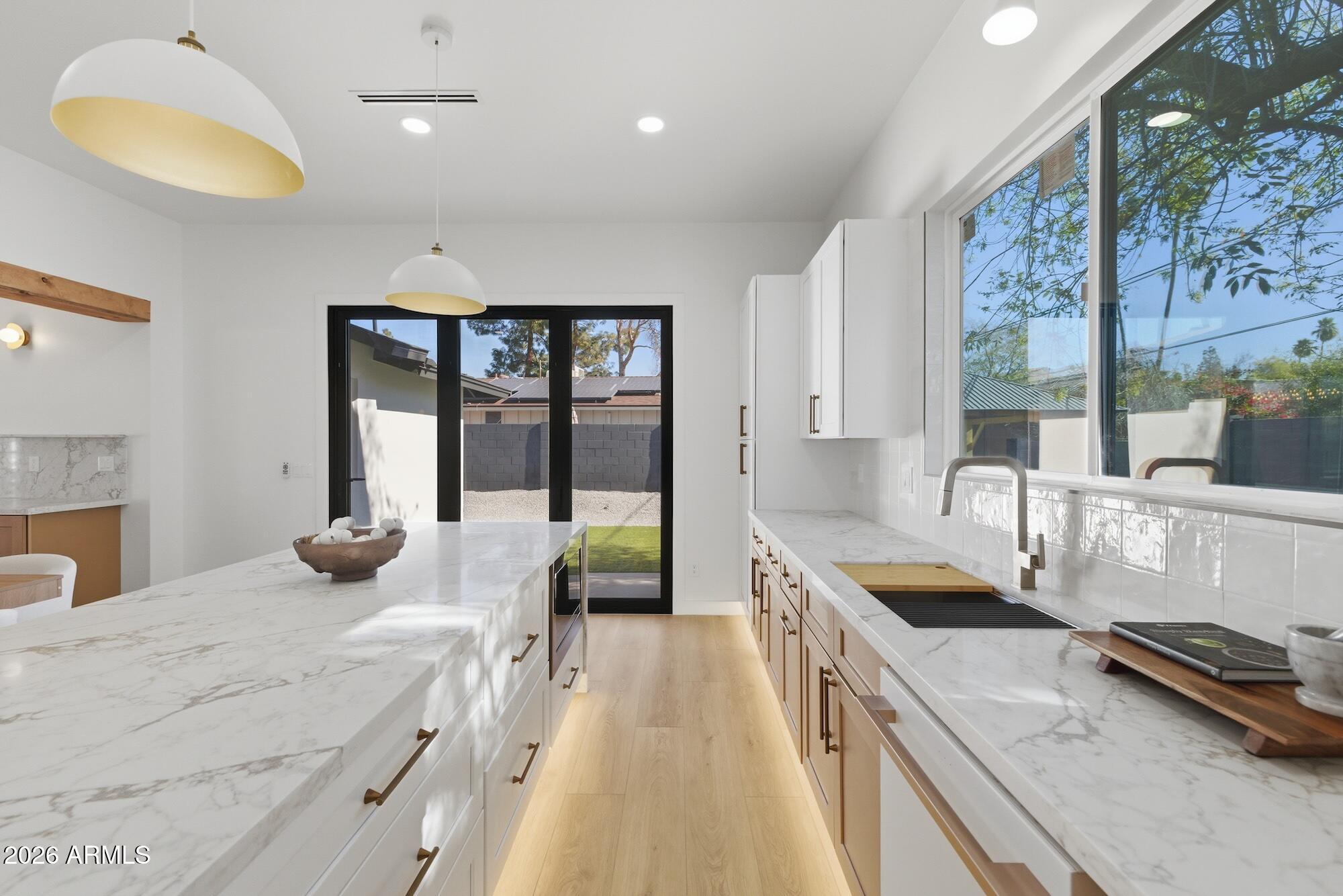 333 West Seldon Lane Phoenix, AZ 85021 - Photo 32 of 73 a kitchen with granite countertop a sink and a stove