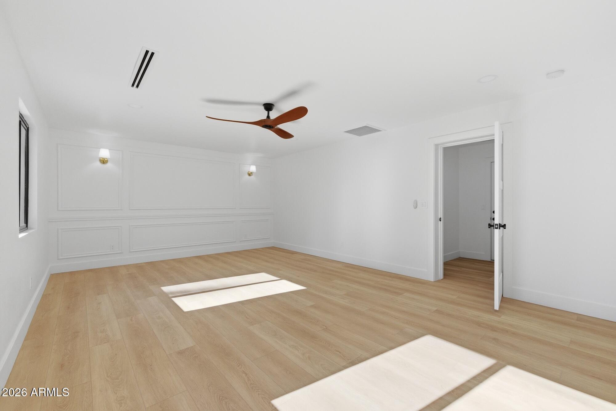 333 West Seldon Lane Phoenix, AZ 85021 - Photo 39 of 73 a view of a room with wooden floor and ceiling fan