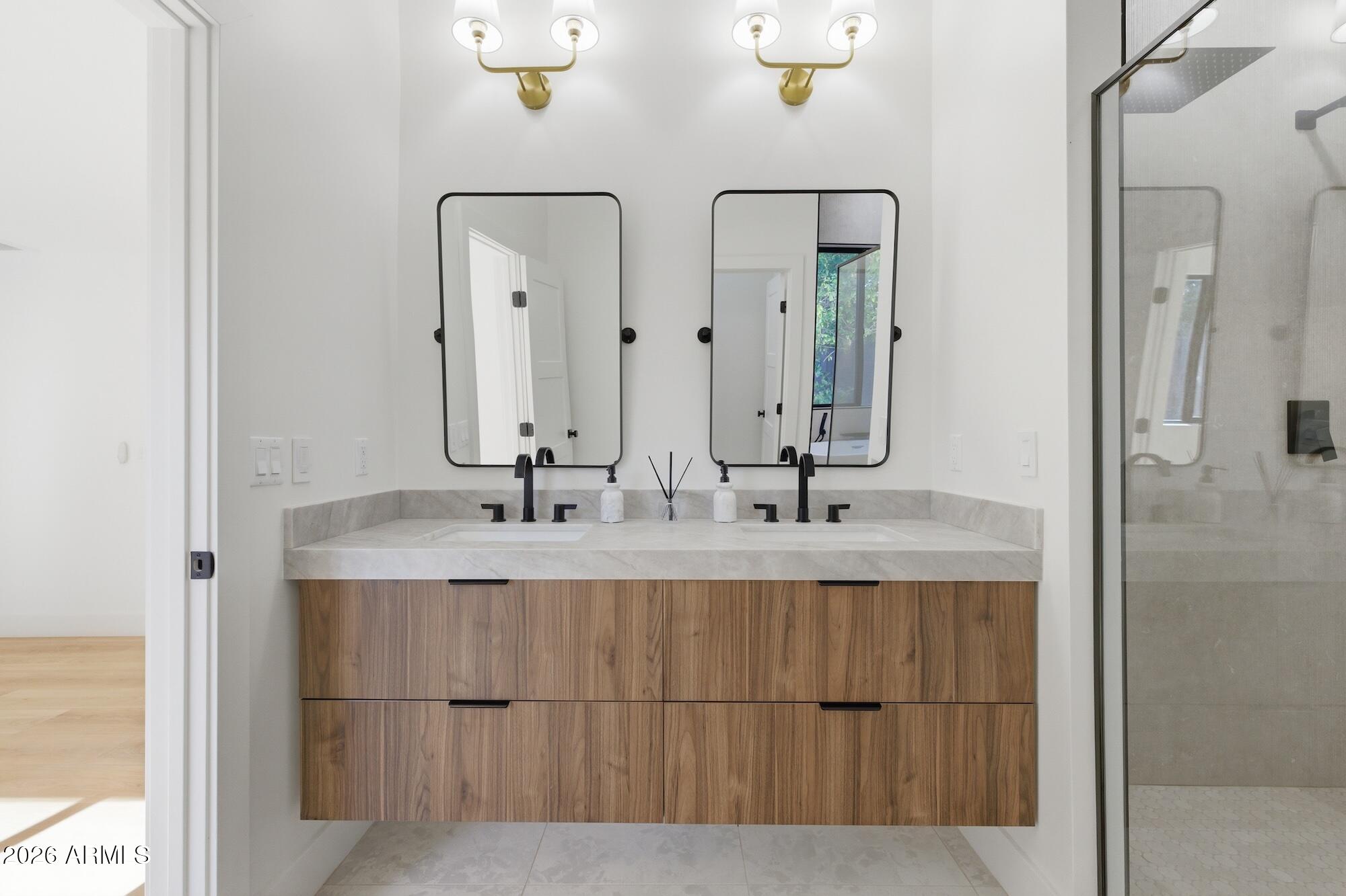 333 West Seldon Lane Phoenix, AZ 85021 - Photo 50 of 73 a bathroom with double vanity sinks and a mirror
