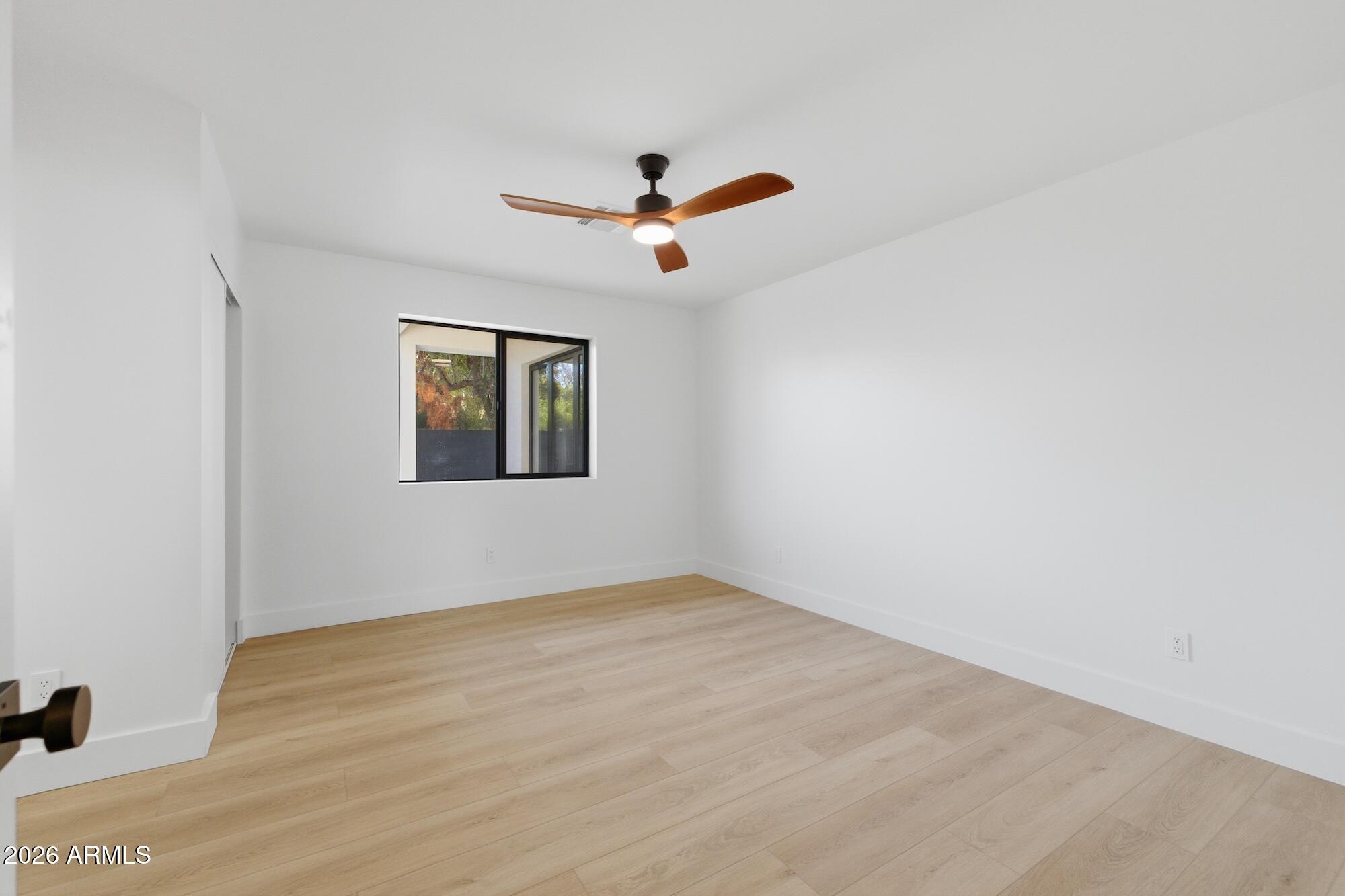 333 West Seldon Lane Phoenix, AZ 85021 - Photo 57 of 73 an empty room with a window and a ceiling fan