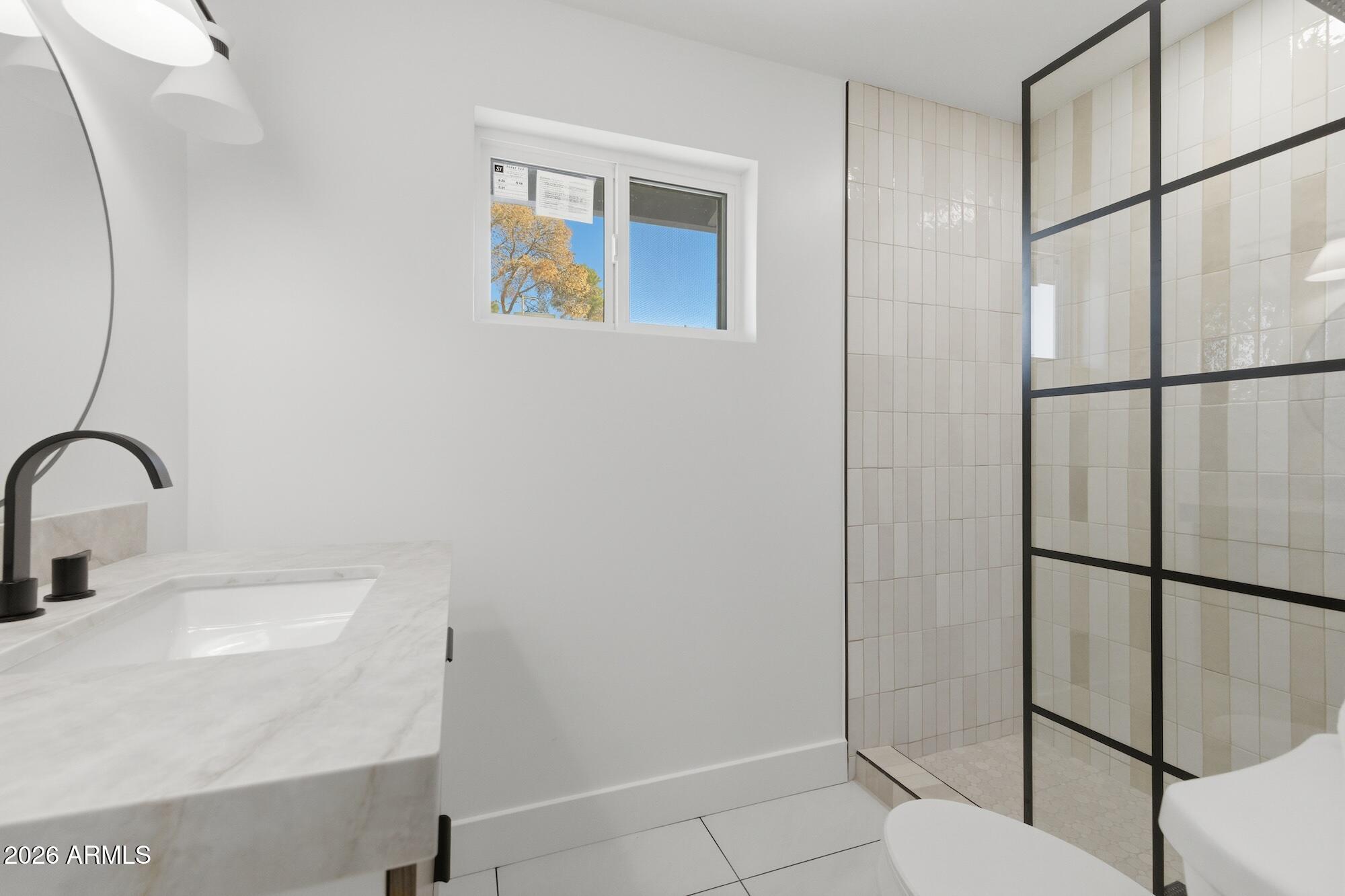 333 West Seldon Lane Phoenix, AZ 85021 - Photo 60 of 73 a bathroom with a sink and mirror