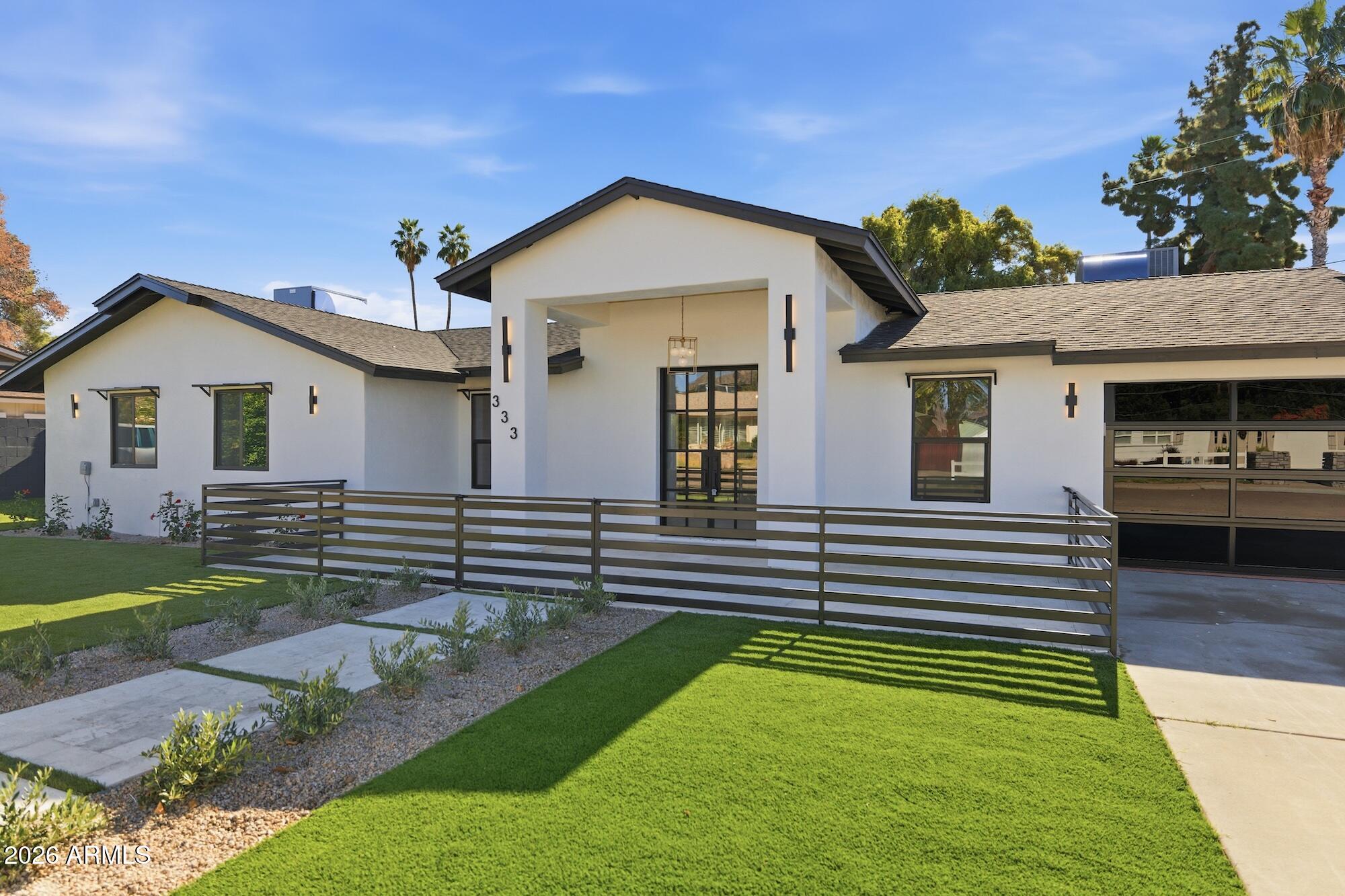 333 West Seldon Lane Phoenix, AZ 85021 - Photo 6 of 73 a front view of a house with a garden