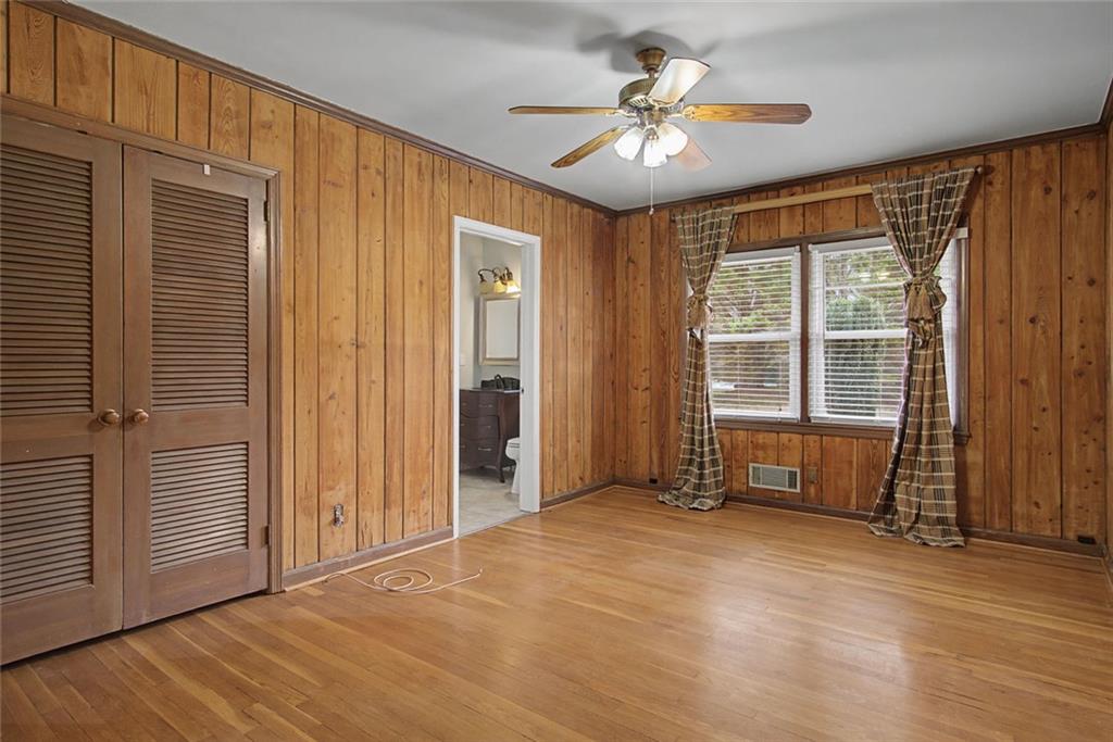 1001 Wiley Bridge Road Woodstock, GA 30188 - Photo 13 of 40 an empty room with ceiling fan and windows