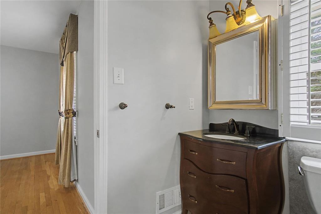 1001 Wiley Bridge Road Woodstock, GA 30188 - Photo 14 of 40 a bathroom with a sink and a mirror