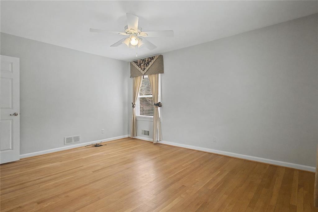 1001 Wiley Bridge Road Woodstock, GA 30188 - Photo 15 of 40 wooden floor in an empty room with a window