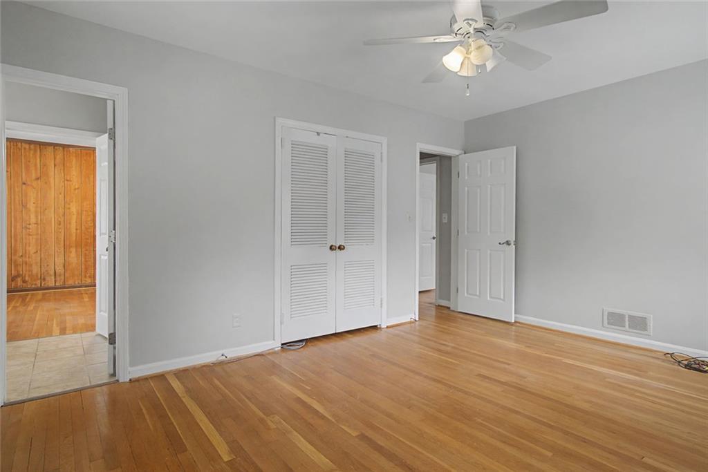 1001 Wiley Bridge Road Woodstock, GA 30188 - Photo 17 of 40 a view of an empty room with wooden floor