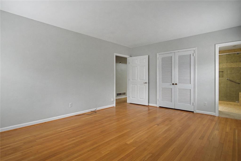 1001 Wiley Bridge Road Woodstock, GA 30188 - Photo 20 of 40 a view of an empty room with wooden floor