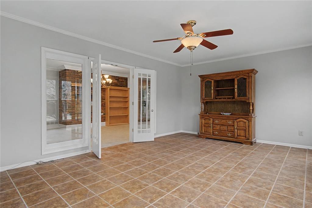 1001 Wiley Bridge Road Woodstock, GA 30188 - Photo 25 of 40 a view of an empty room with cabinet and a ceiling fan