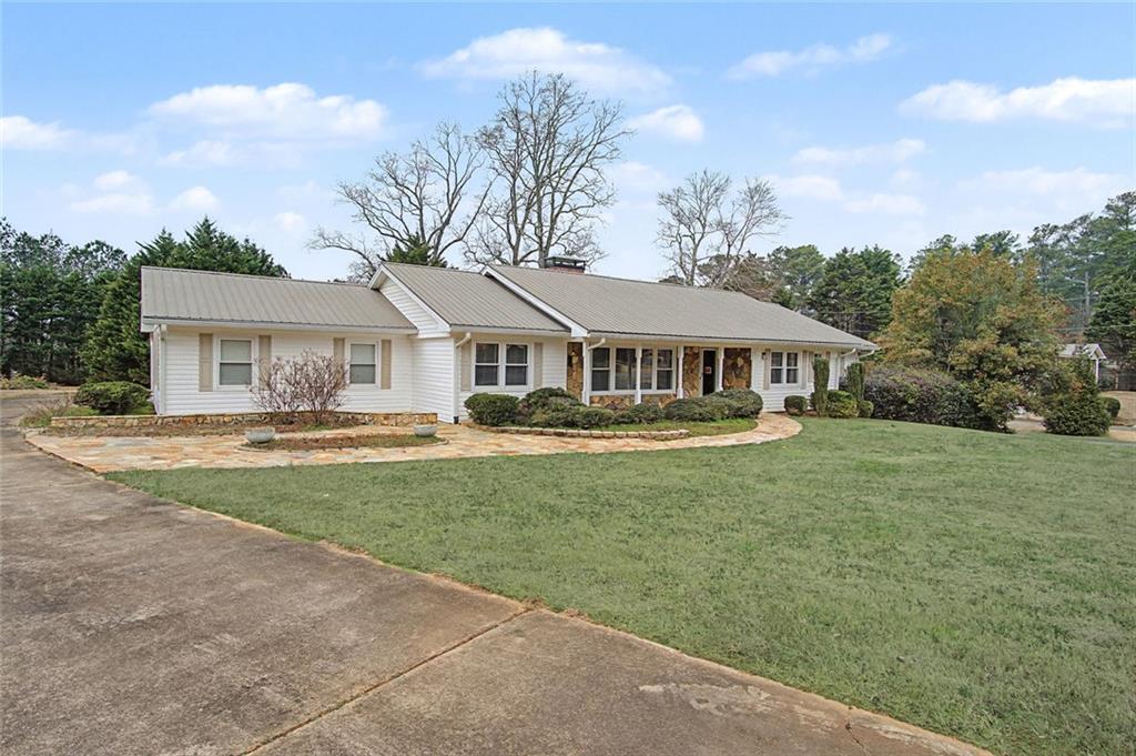 1001 Wiley Bridge Road Woodstock, GA 30188 - Photo 3 of 40 a front view of a house with garden and porch