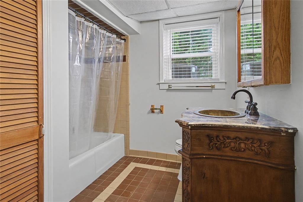 1001 Wiley Bridge Road Woodstock, GA 30188 - Photo 38 of 40 a bathroom with a bathtub and a sink