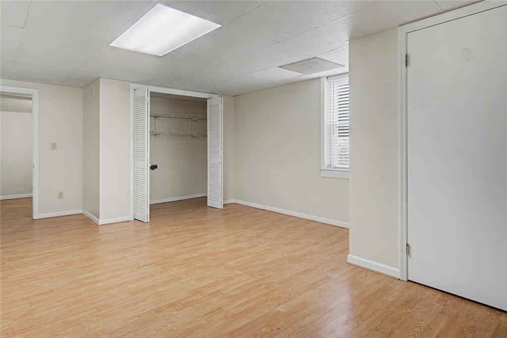 1001 Wiley Bridge Road Woodstock, GA 30188 - Photo 40 of 40 a view of an empty room with wooden floor and closet
