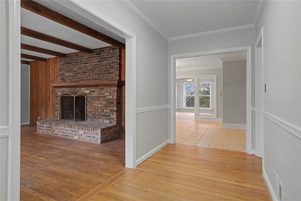 1001 Wiley Bridge Road Woodstock, GA 30188 - Photo 5 of 40 a view of a hallway with wooden floor and a living room
