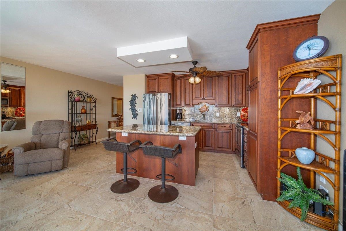 2387 South Kihei Road, Unit B303 Kihei, HI 96753 - Photo 22 of 48 a living room with furniture and wooden floor