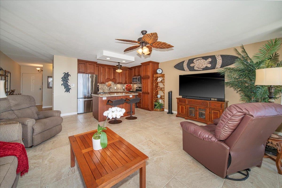 2387 South Kihei Road, Unit B303 Kihei, HI 96753 - Photo 27 of 48 a living room with furniture and a flat screen tv