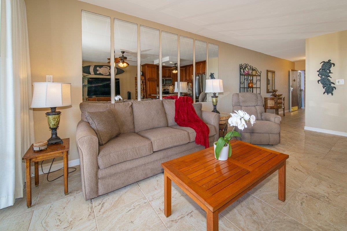 2387 South Kihei Road, Unit B303 Kihei, HI 96753 - Photo 28 of 48 a living room with furniture and a lamp