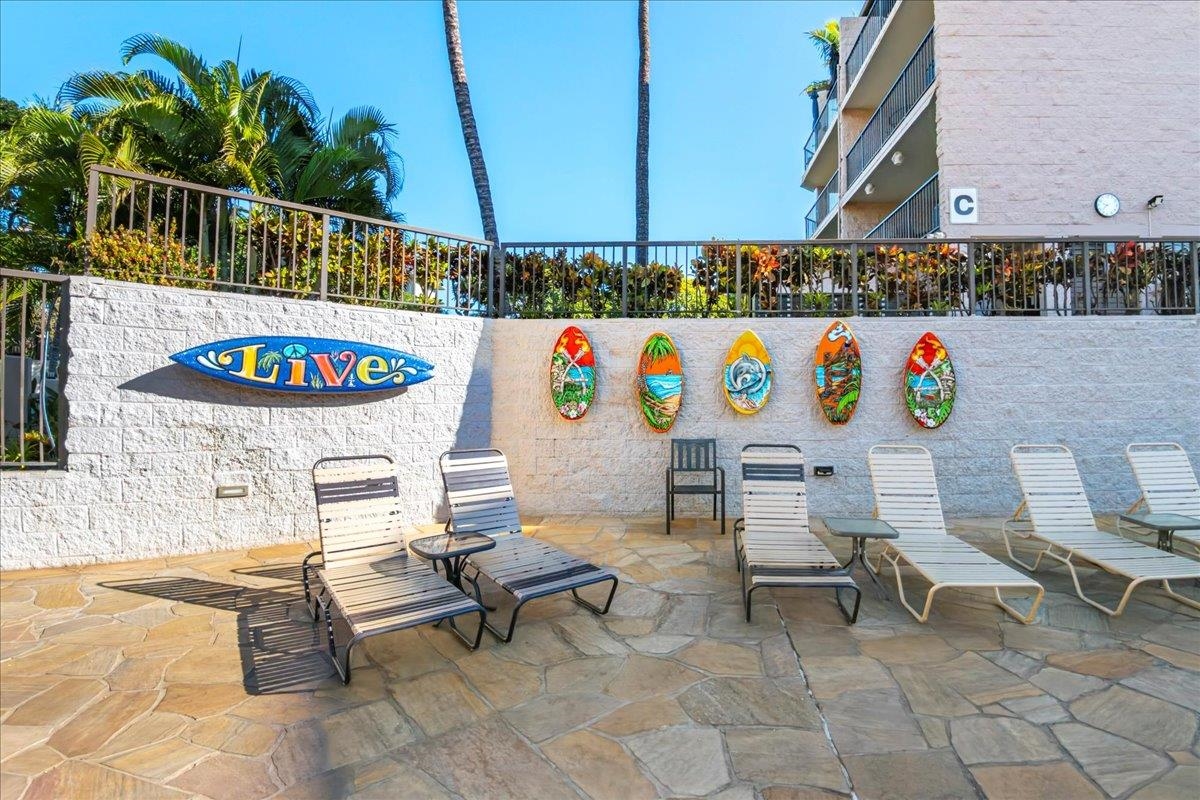 2387 South Kihei Road, Unit B303 Kihei, HI 96753 - Photo 30 of 48 a bunch of tables and chairs with potted plants