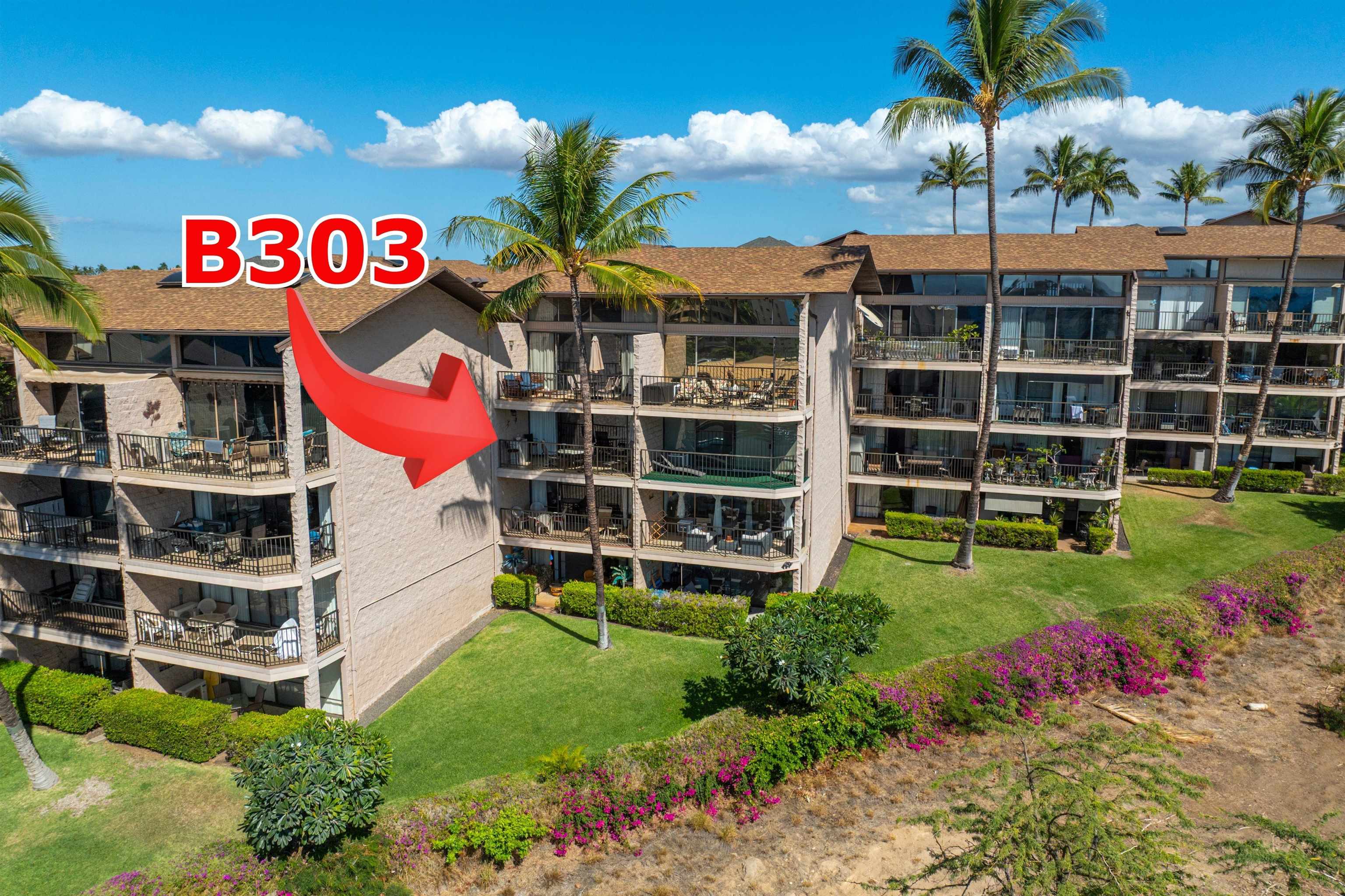 2387 South Kihei Road, Unit B303 Kihei, HI 96753 - Photo 41 of 48 a view of a house with a yard and potted plants