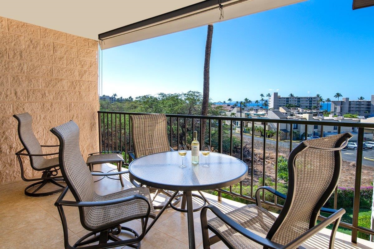 2387 South Kihei Road, Unit B303 Kihei, HI 96753 - Photo 6 of 48 a balcony with table and chairs