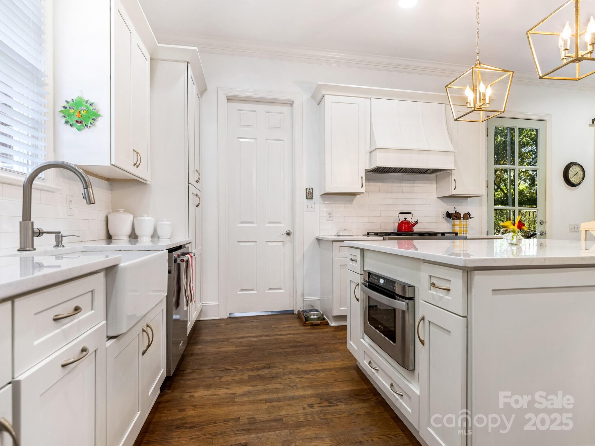 1110 Princeton Avenue Charlotte, NC 28209 - Photo 14 of 29 a kitchen with granite countertop white cabinets and white appliances