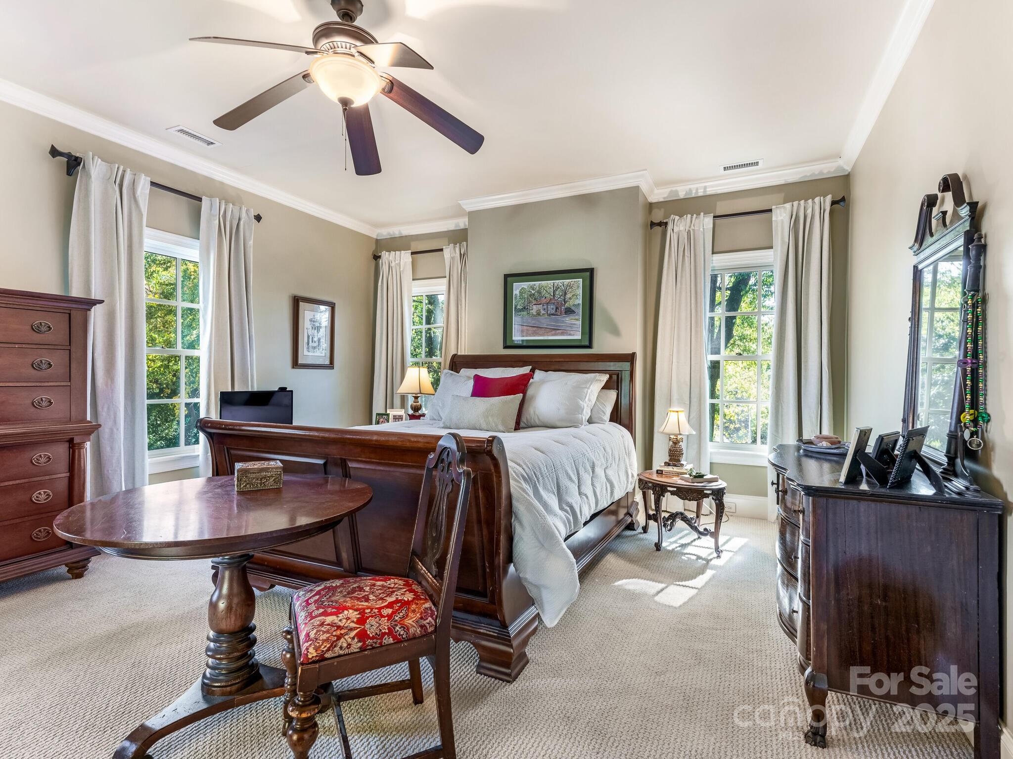 1110 Princeton Avenue Charlotte, NC 28209 - Photo 16 of 29 a bedroom with a bed and a chandelier