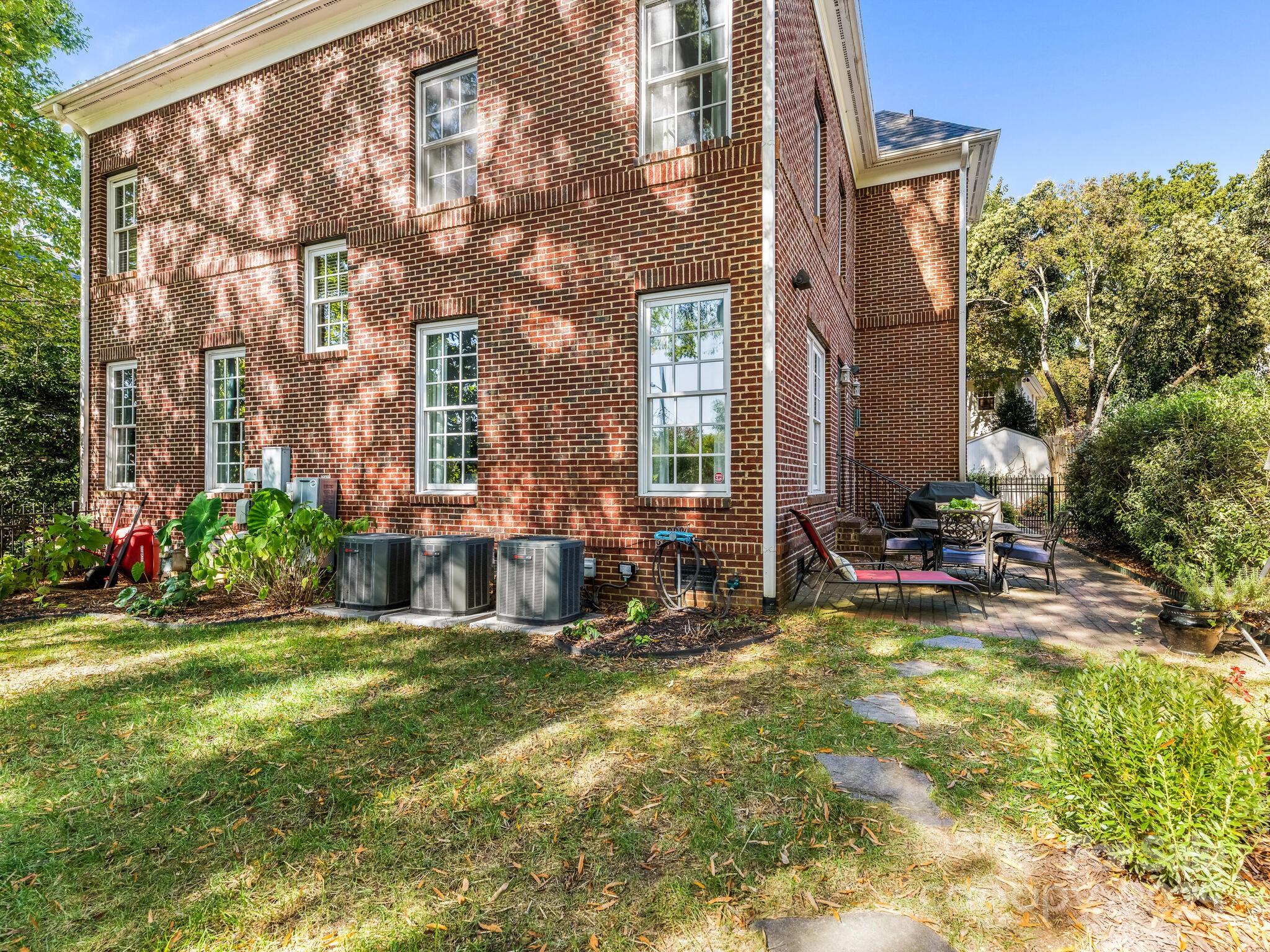 1110 Princeton Avenue Charlotte, NC 28209 - Photo 29 of 29 a view of a house with backyard sitting area and garden