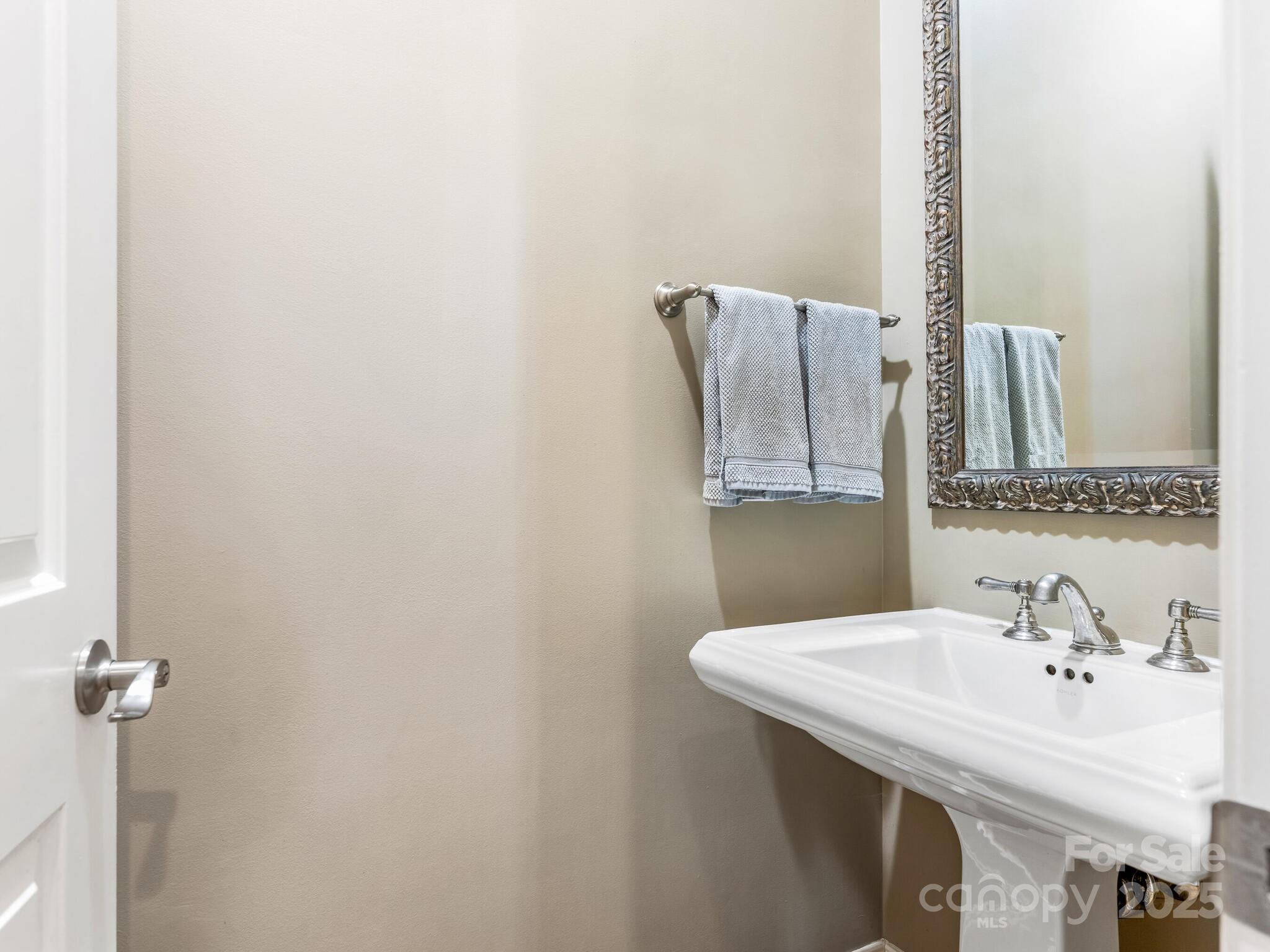 1110 Princeton Avenue Charlotte, NC 28209 - Photo 9 of 29 a bathroom with a sink and a mirror