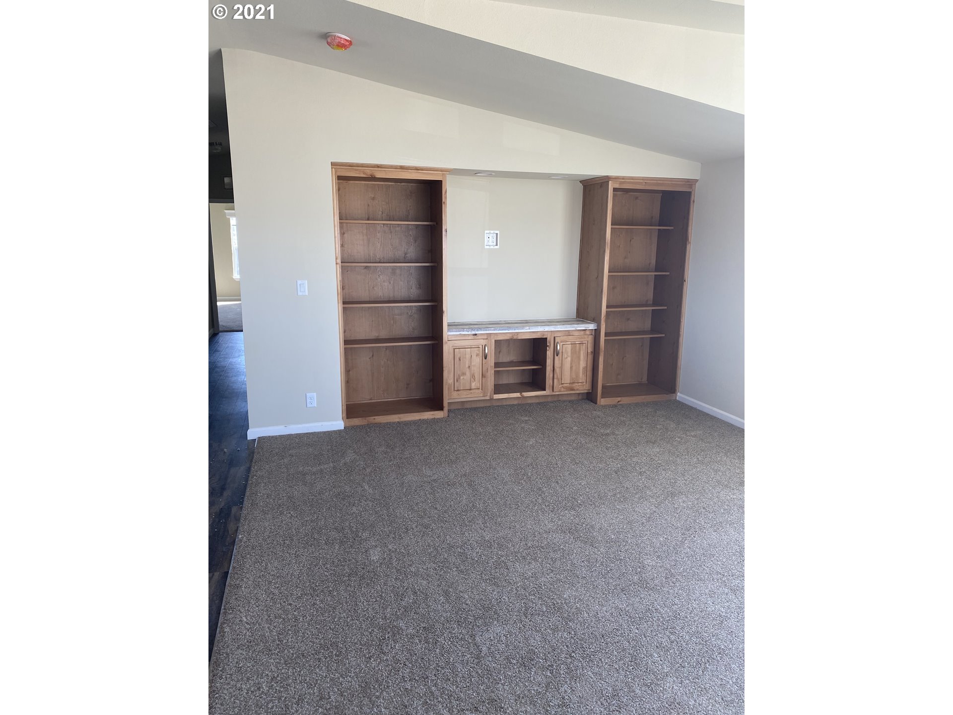 305 Oregon Trail Boulevard Boardman, OR 97818 - Photo 4 of 11 a view of a bedroom with closet and cabinet