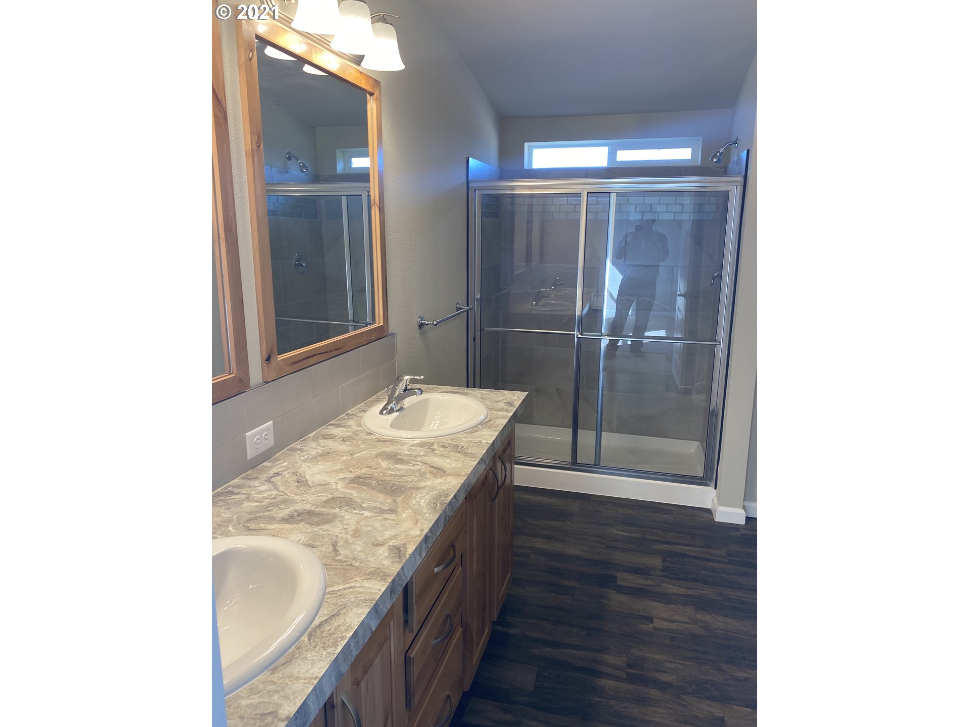 305 Oregon Trail Boulevard Boardman, OR 97818 - Photo 7 of 11 a bathroom with a granite countertop sink and a mirror