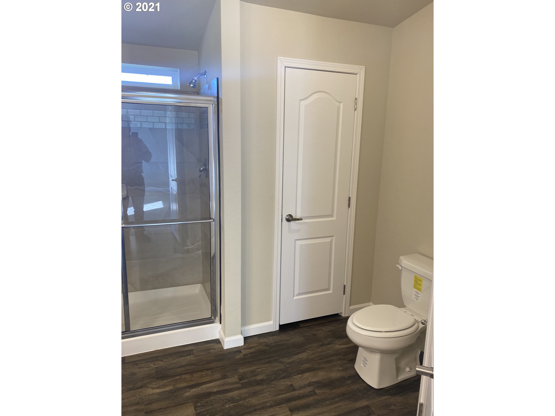 305 Oregon Trail Boulevard Boardman, OR 97818 - Photo 8 of 11 a white toilet sitting next to a bathroom sink