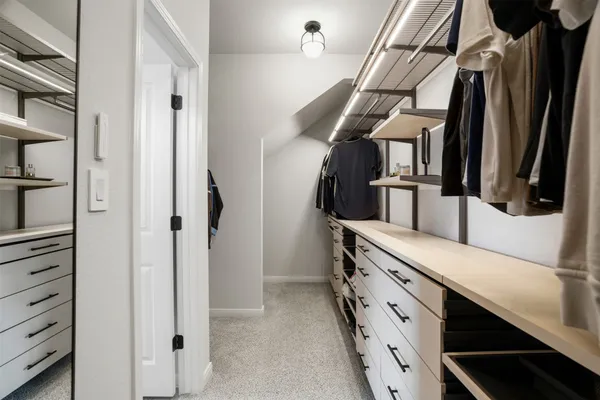a bathroom with a shower and a mirror