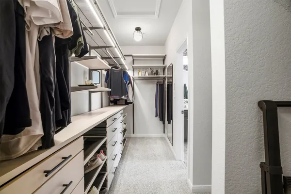 a kitchen with stainless steel appliances a refrigerator and cabinets
