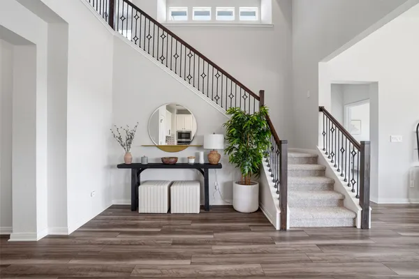 a view of an entryway with wooden floor