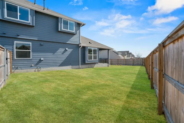 a front view of a house with a garden and porch