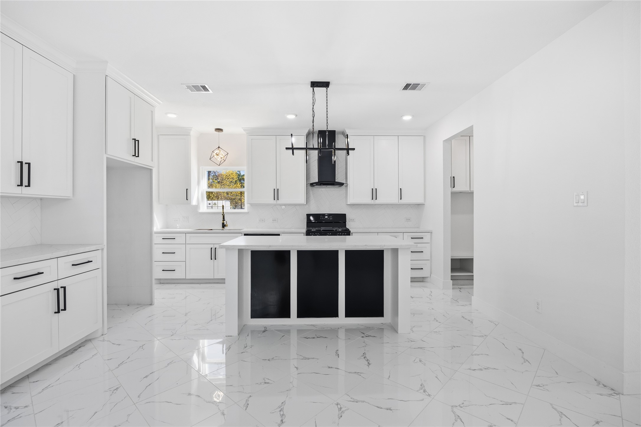 6063 Townsan Road Houston, TX 77396 - Photo 15 of 46 a kitchen with stainless steel appliances a stove sink and cabinets