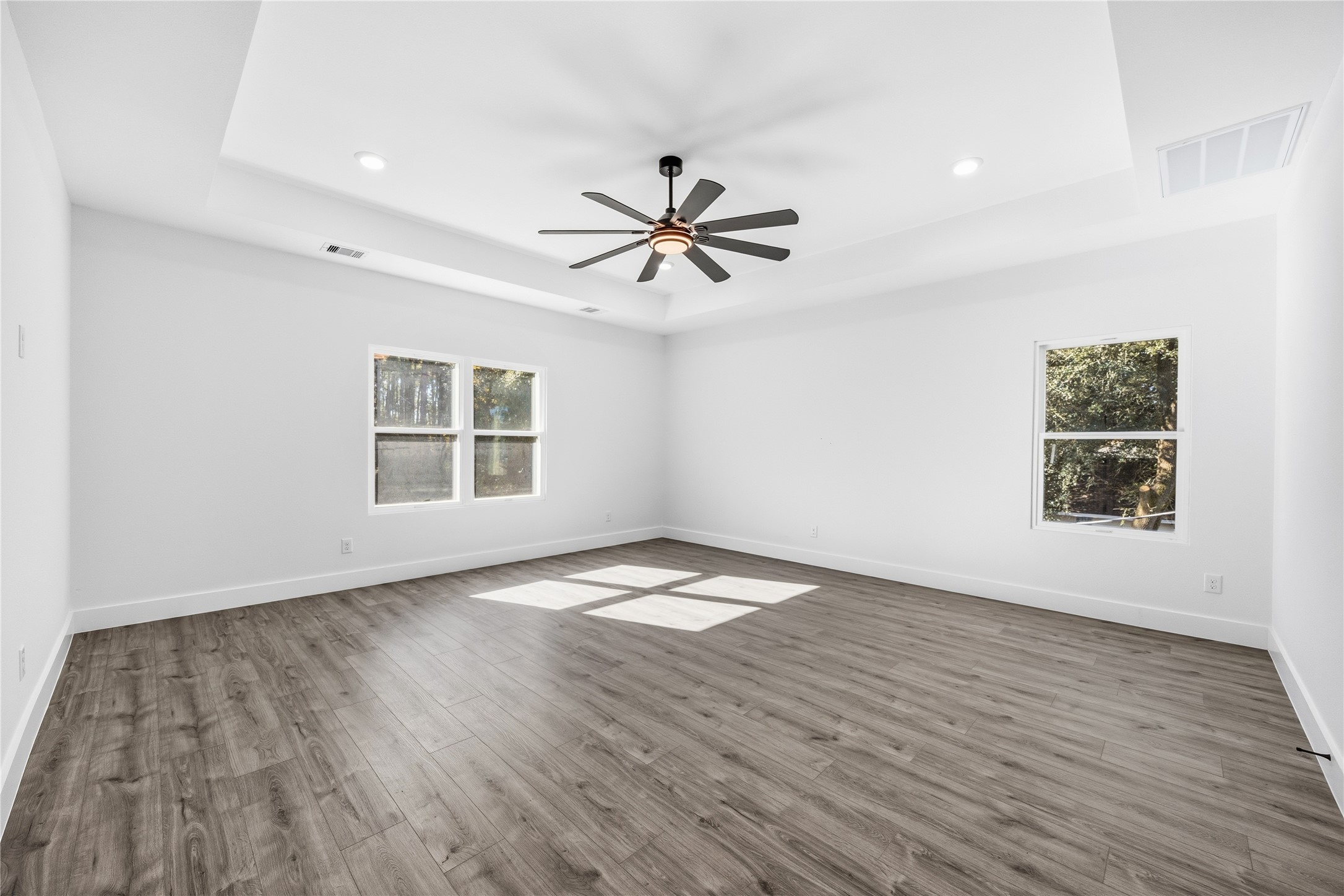 6063 Townsan Road Houston, TX 77396 - Photo 24 of 46 wooden floor in an empty room with a window