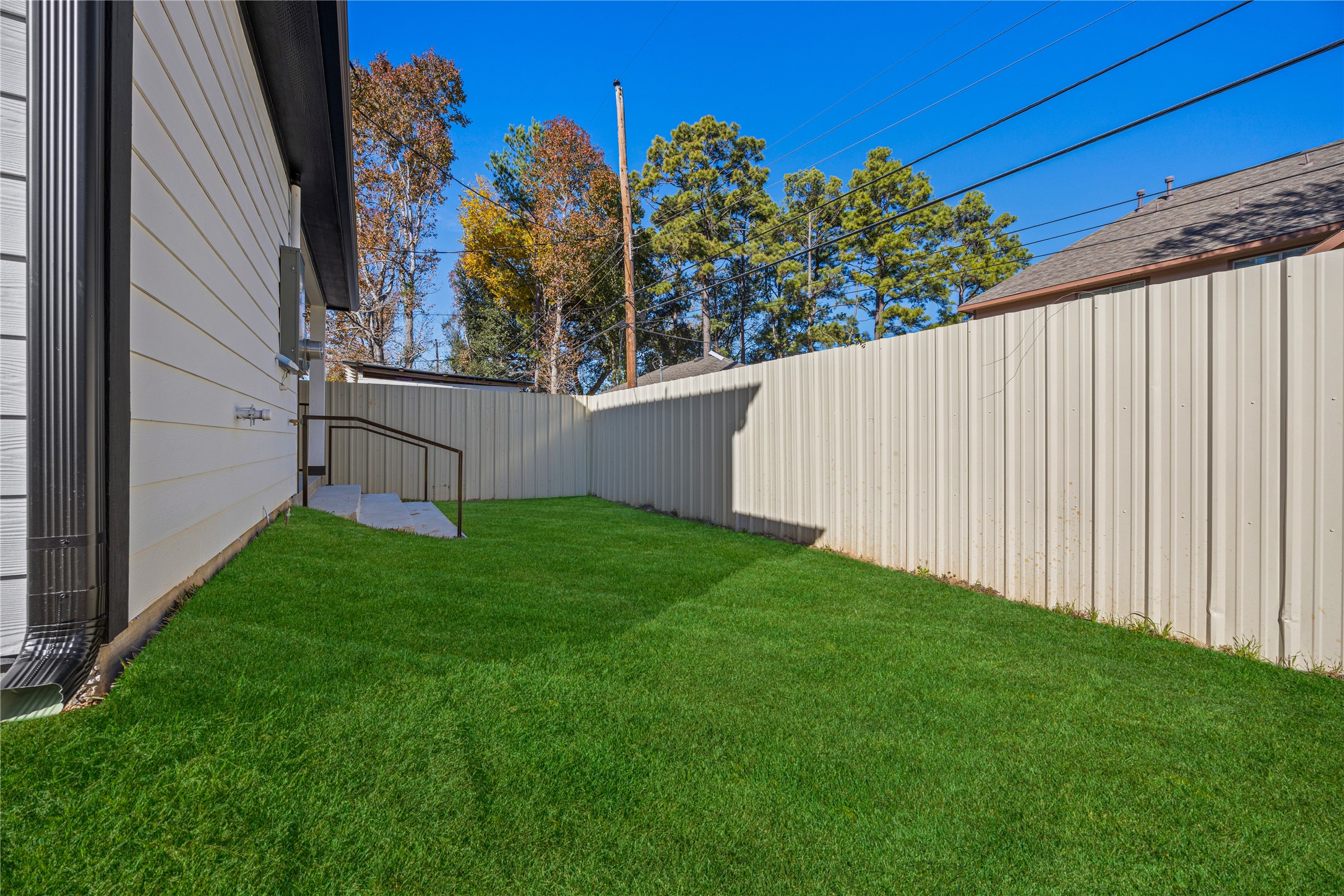 6063 Townsan Road Houston, TX 77396 - Photo 40 of 46 a view of a backyard with potted plants and wooden fence