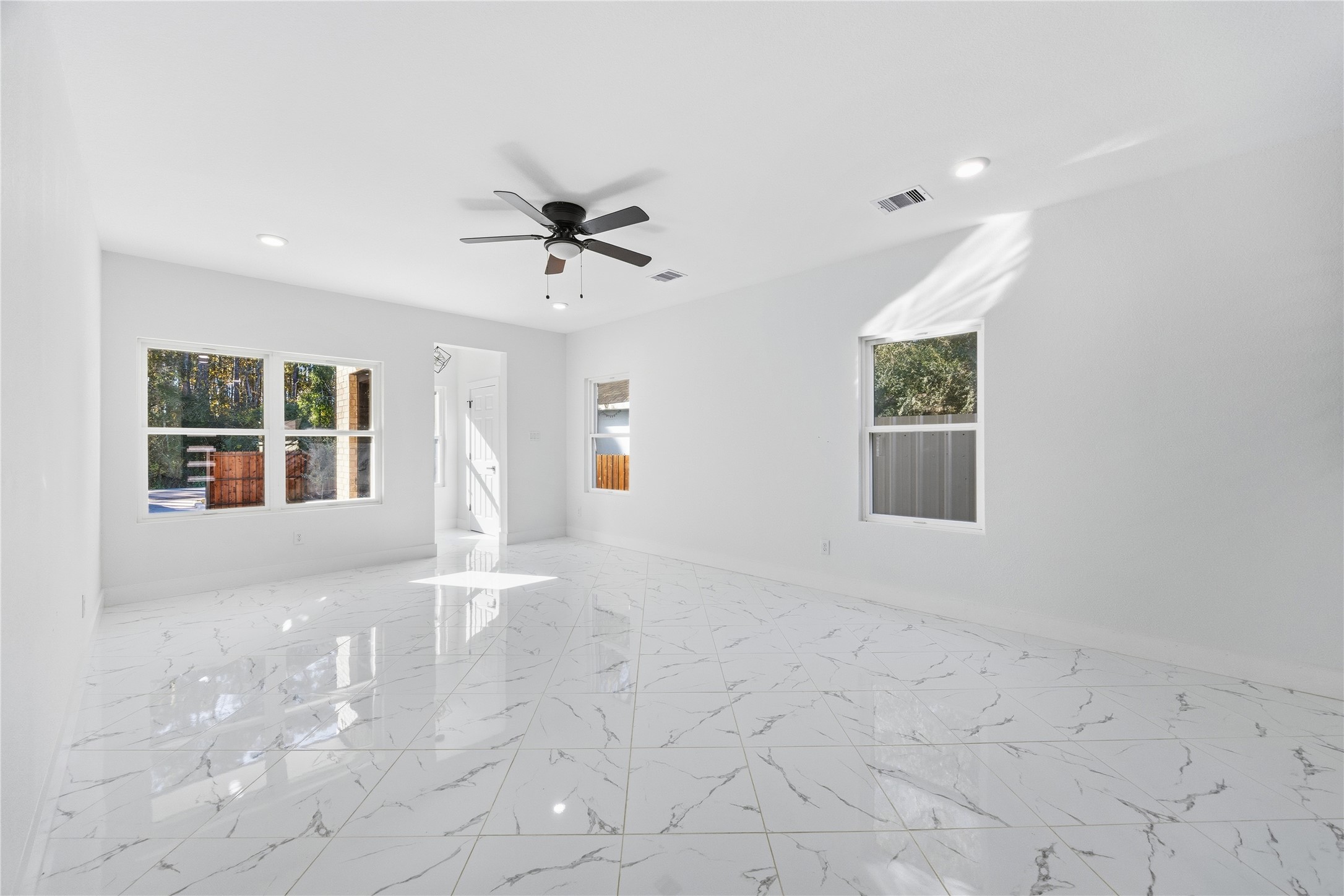 6063 Townsan Road Houston, TX 77396 - Photo 7 of 46 a view of an empty room with a window