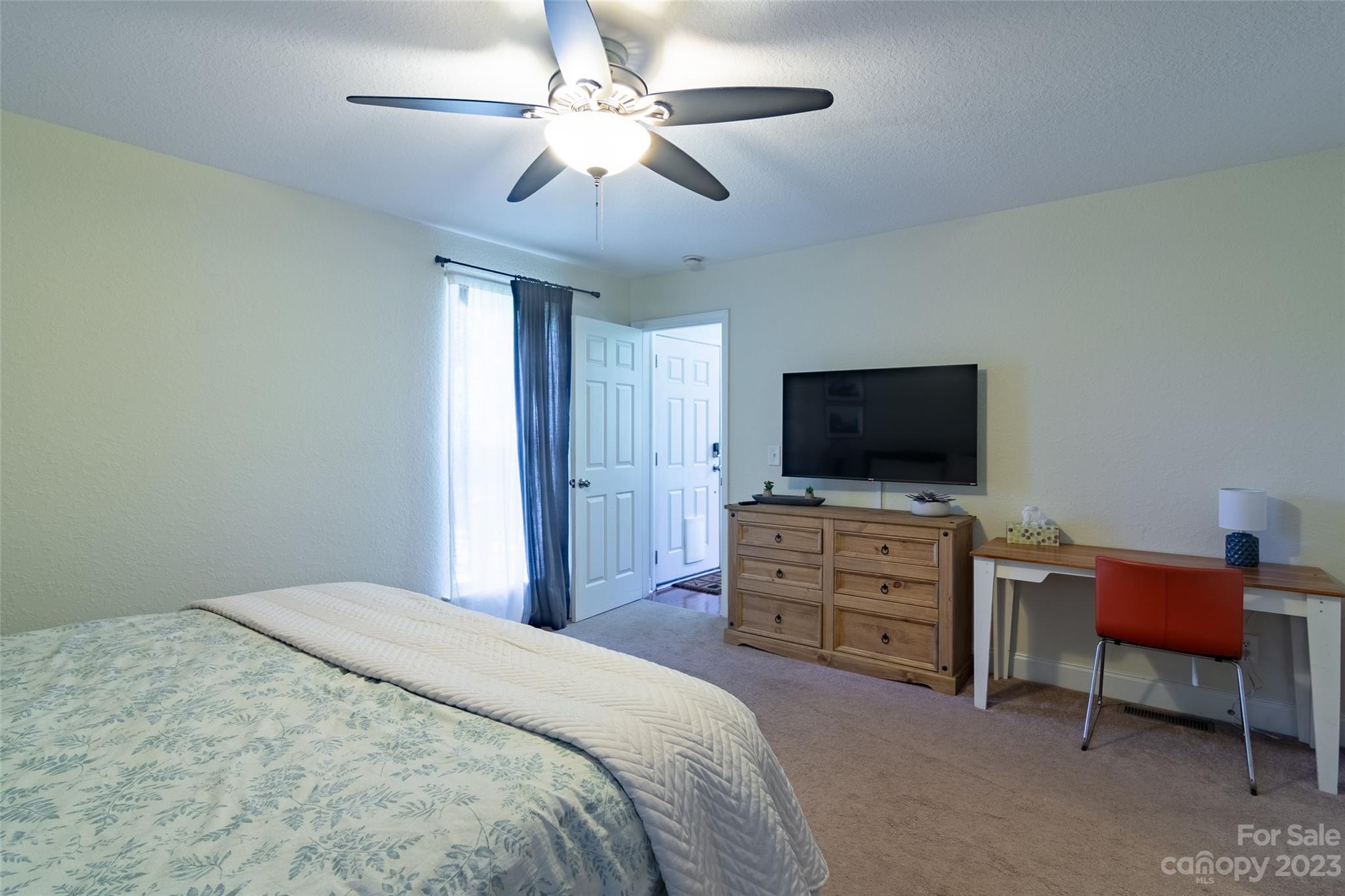 125 Parris Field Road Bryson City, NC 28713 - Photo 15 of 25 a bedroom with a bed and a flat screen tv