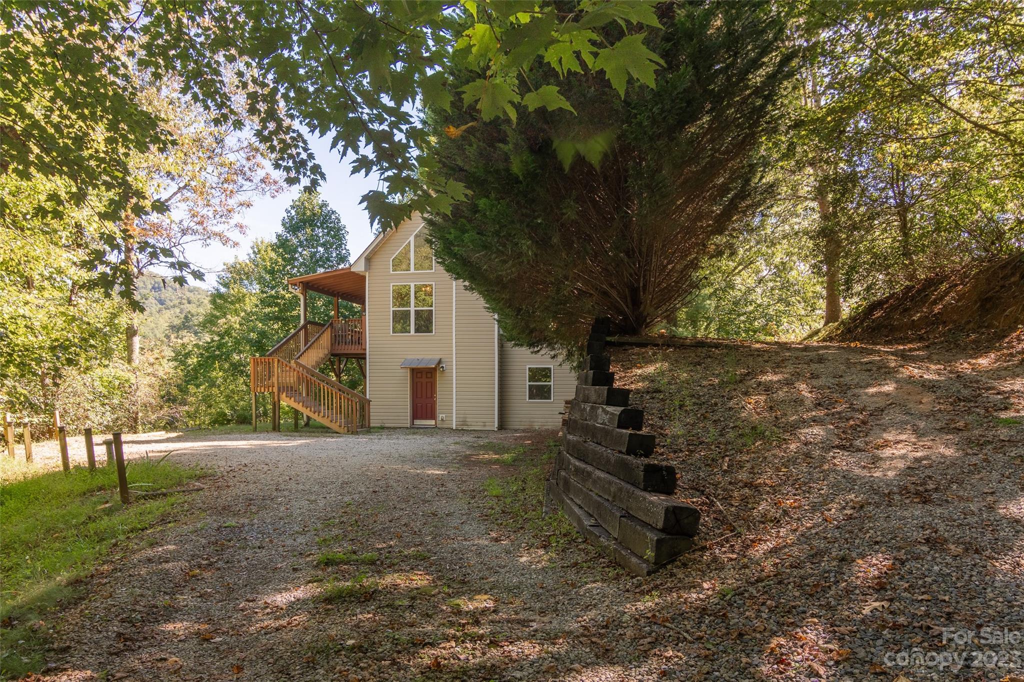 125 Parris Field Road Bryson City, NC 28713 - Photo 4 of 25 a view of a house with a tree