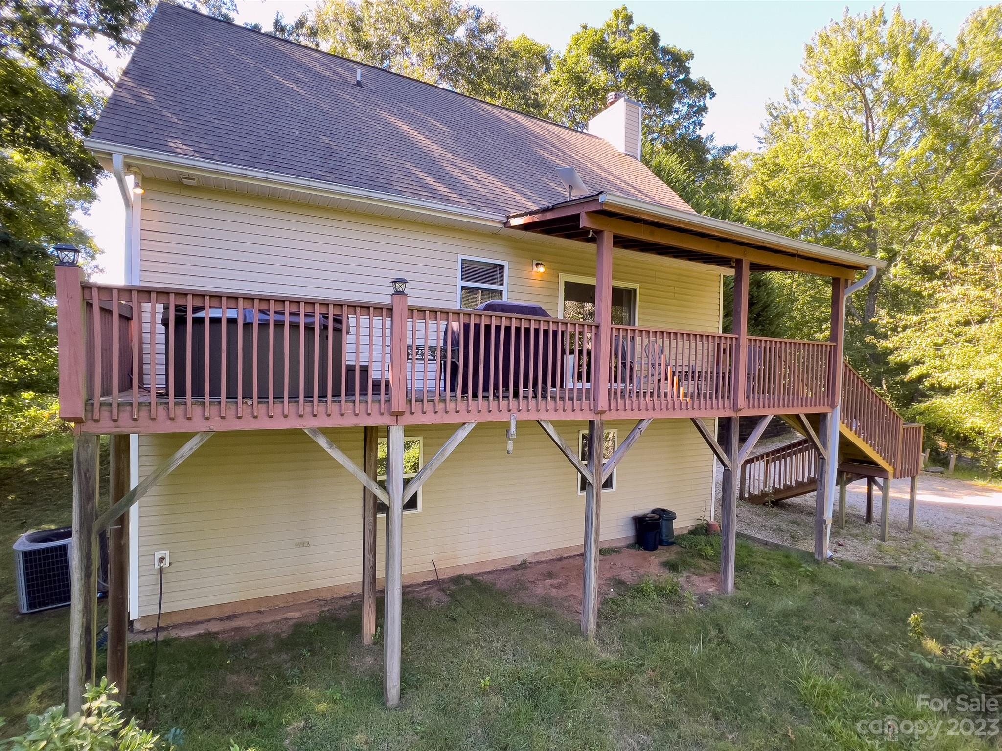 125 Parris Field Road Bryson City, NC 28713 - Photo 5 of 25 a view of a house with a yard chairs and table