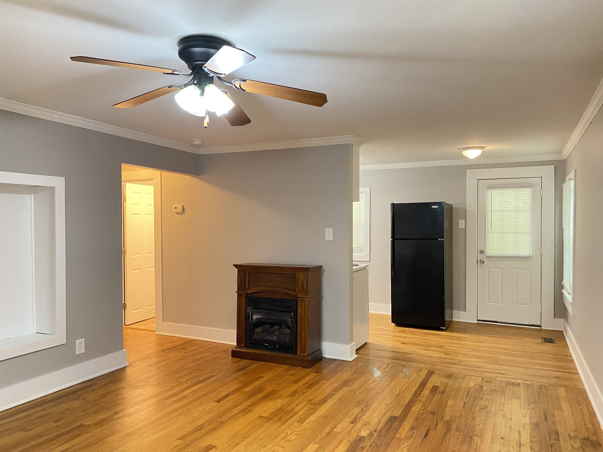 204 Rudolph Drive Clarksville, TN 37040 - Photo 3 of 19 a view of an empty room with wooden floor and a window