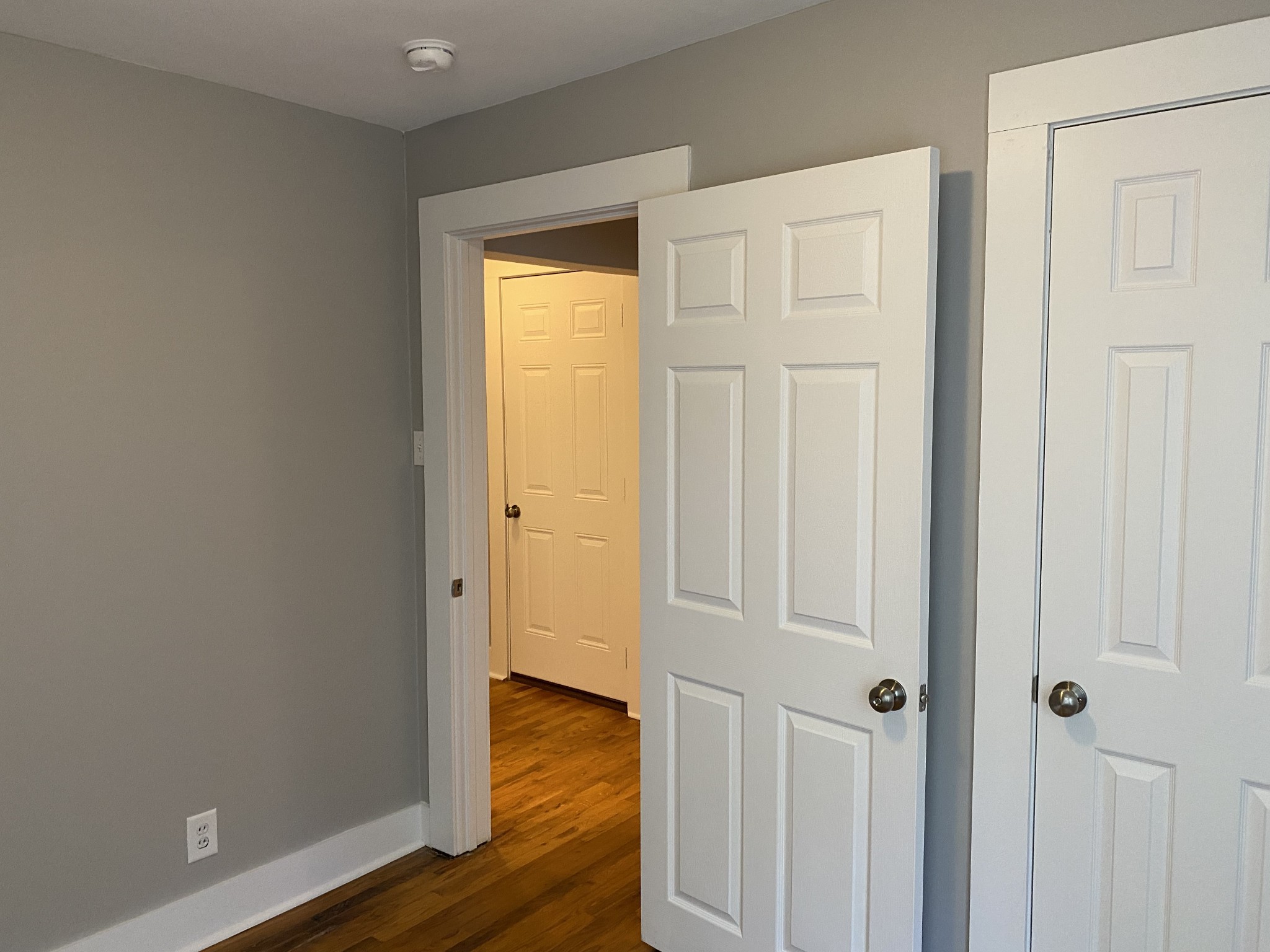 204 Rudolph Drive Clarksville, TN 37040 - Photo 10 of 19 an empty room with wooden floor and closet area