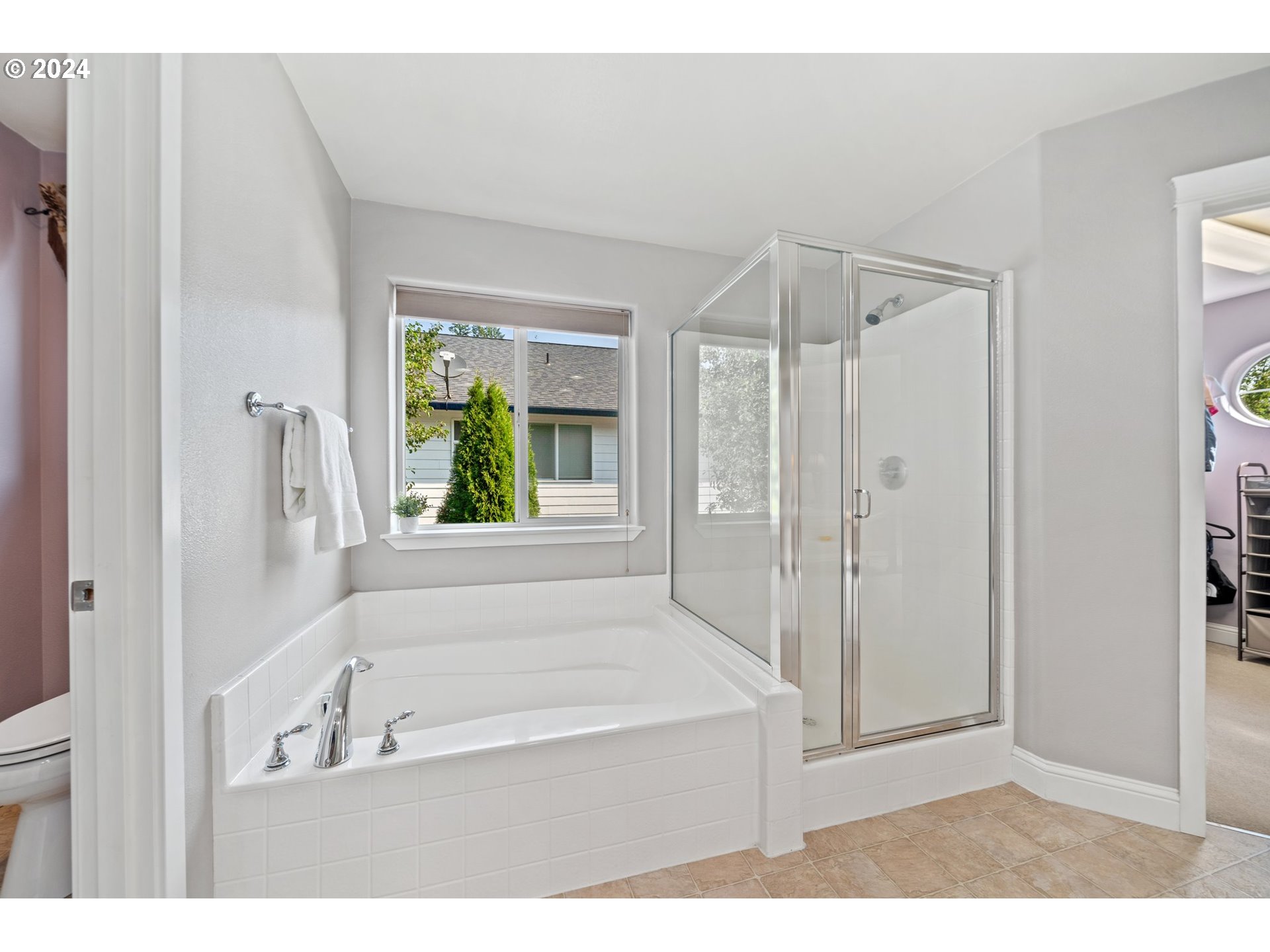 3779 Northwest 4th Way Hillsboro, OR 97124 - Photo 20 of 24 a bathroom with a tub shower and sink