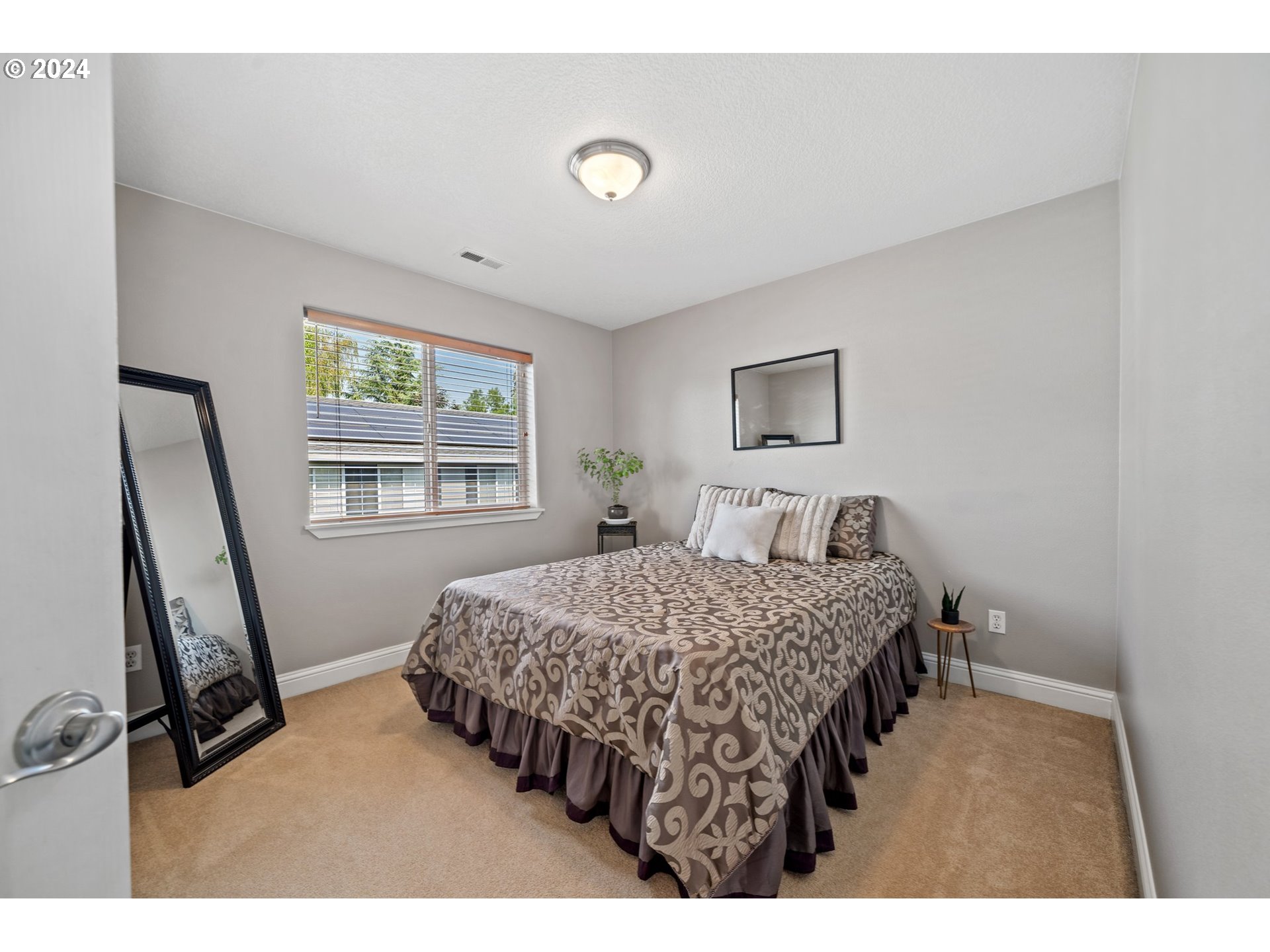 3779 Northwest 4th Way Hillsboro, OR 97124 - Photo 21 of 24 a bedroom with a bed and a window
