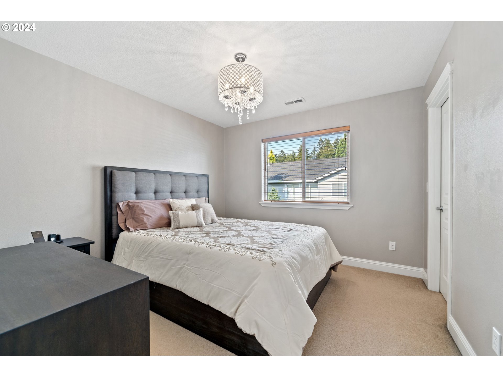 3779 Northwest 4th Way Hillsboro, OR 97124 - Photo 23 of 24 a bedroom with a bed and a window