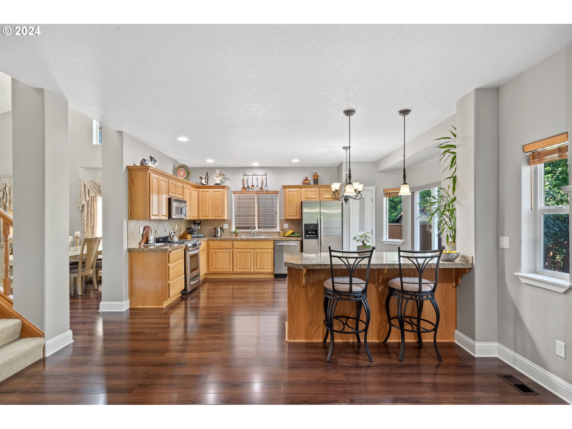 3779 Northwest 4th Way Hillsboro, OR 97124 - Photo 9 of 24 a view of a dining room with furniture and wooden floor
